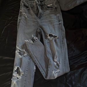Grey ripped/ ruffled at bottom American Eagle Jeans.